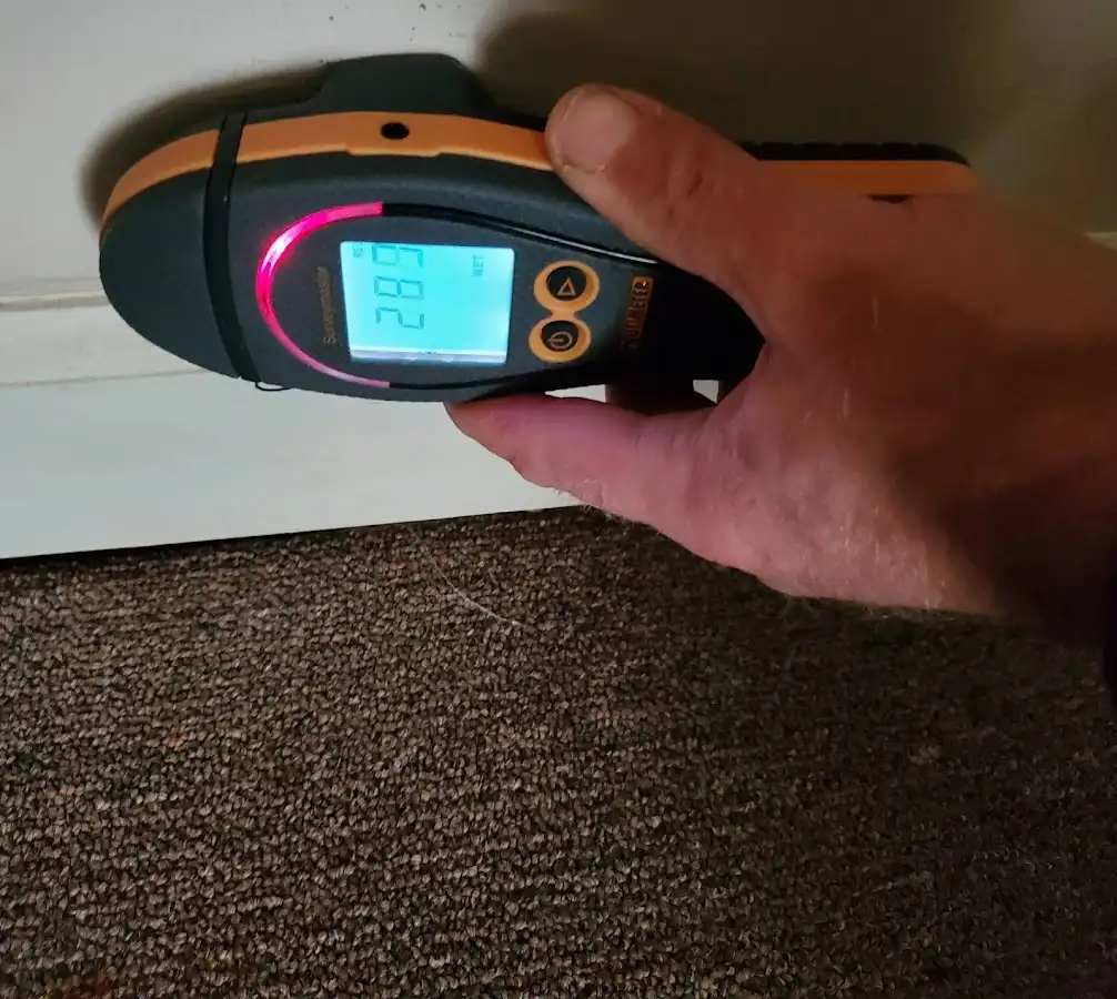 Moisture detection at baseboard during Burst Pipe Cleanup in Key Largo